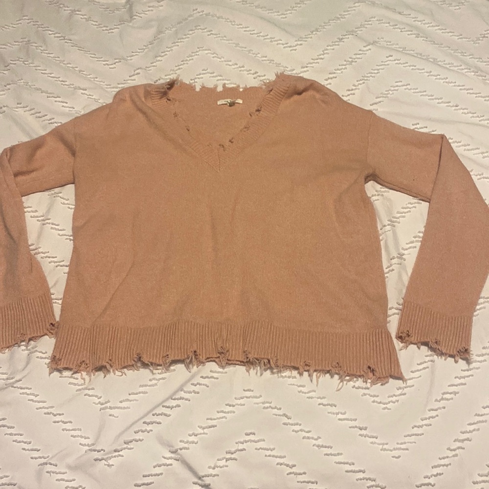pink maurice’s fringed sweater